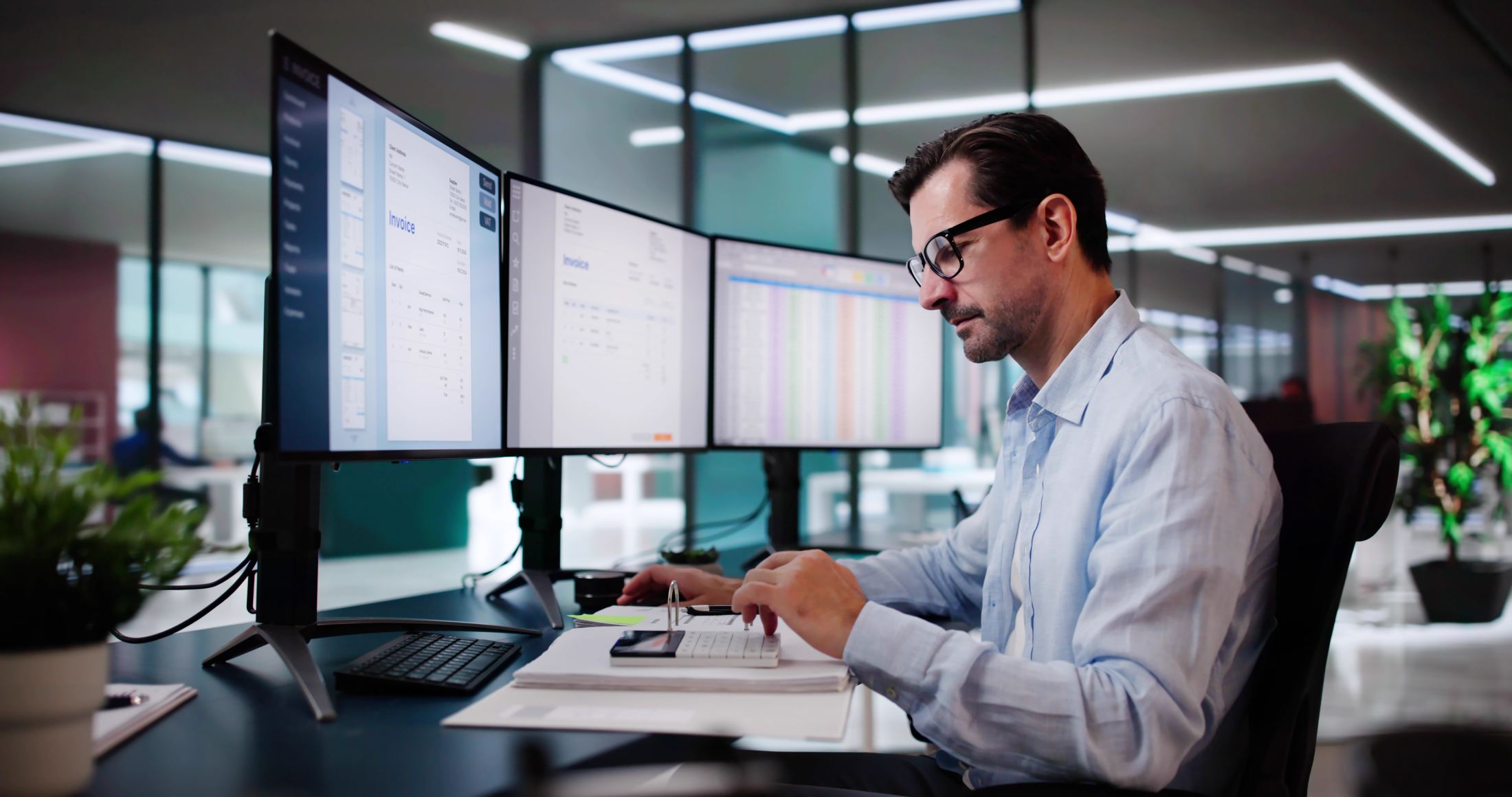 Financial reports and bookkeeping activity displayed on office monitors